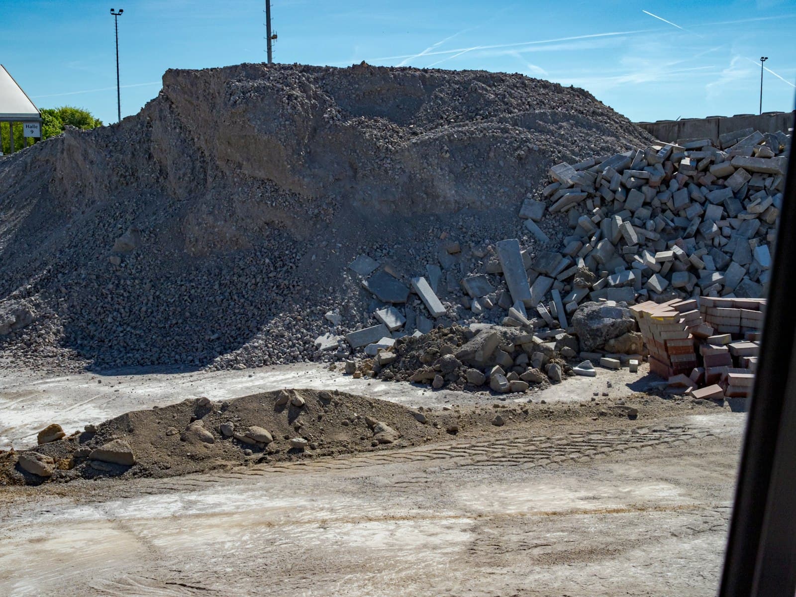Crushed stone and broken concrete slabs at a construction materials recycling yard